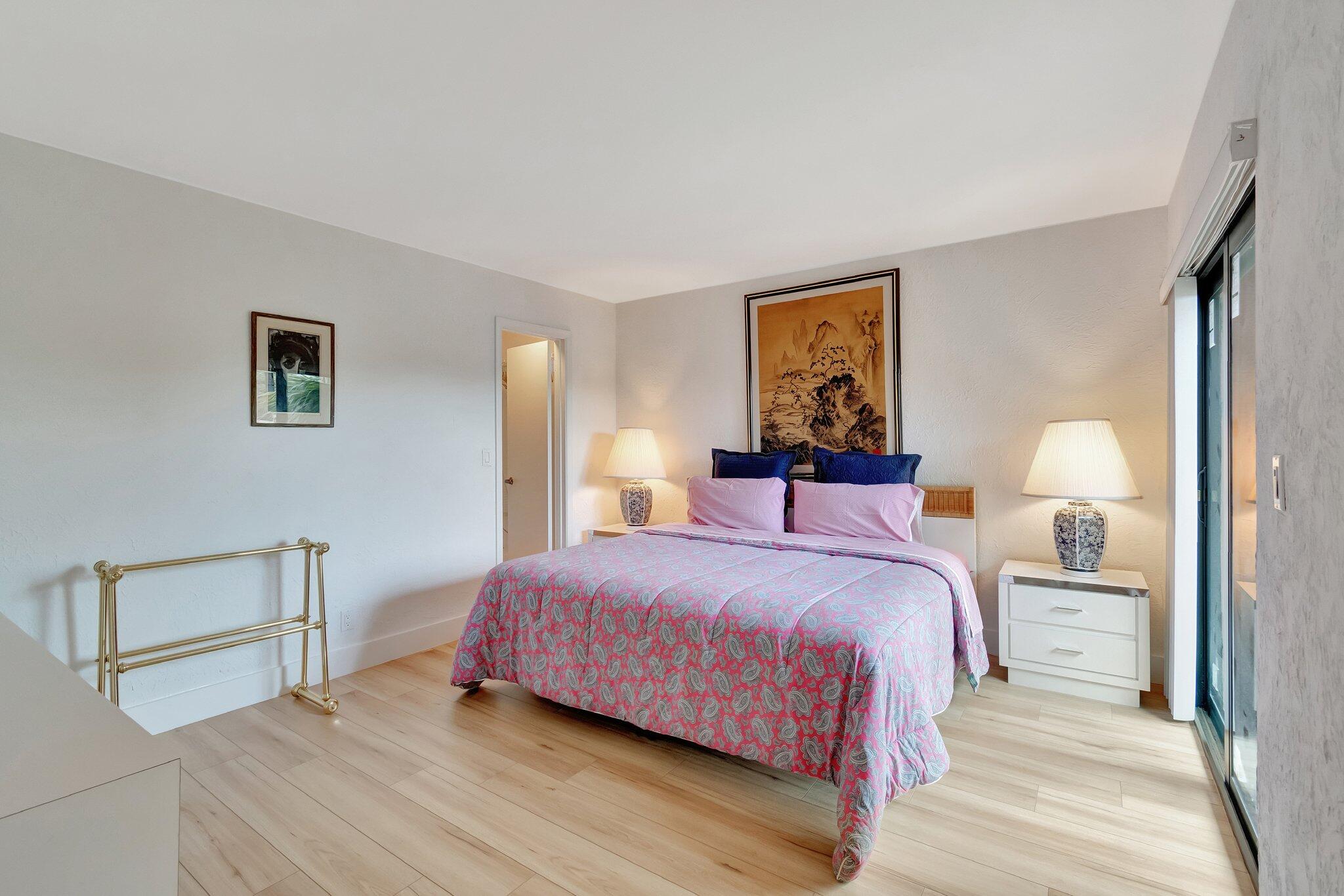 6427 Via Rosa Boca Raton, FL 33433 - Photo 53 of 80 a bedroom with a bed and a painting on the wall