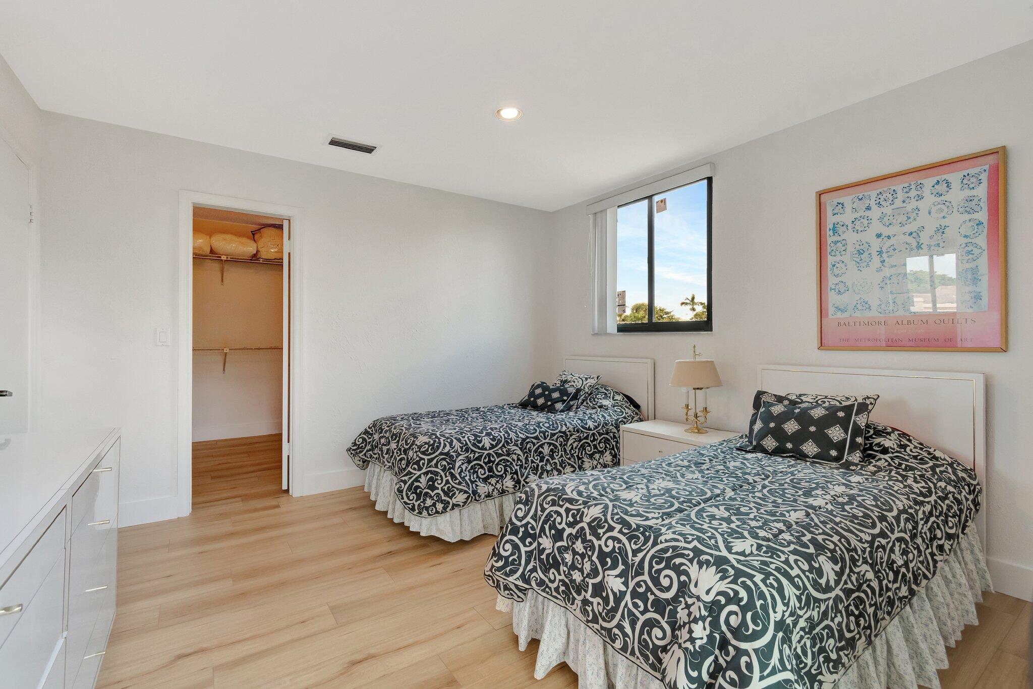 6427 Via Rosa Boca Raton, FL 33433 - Photo 60 of 80 a bedroom with two beds and wooden floor