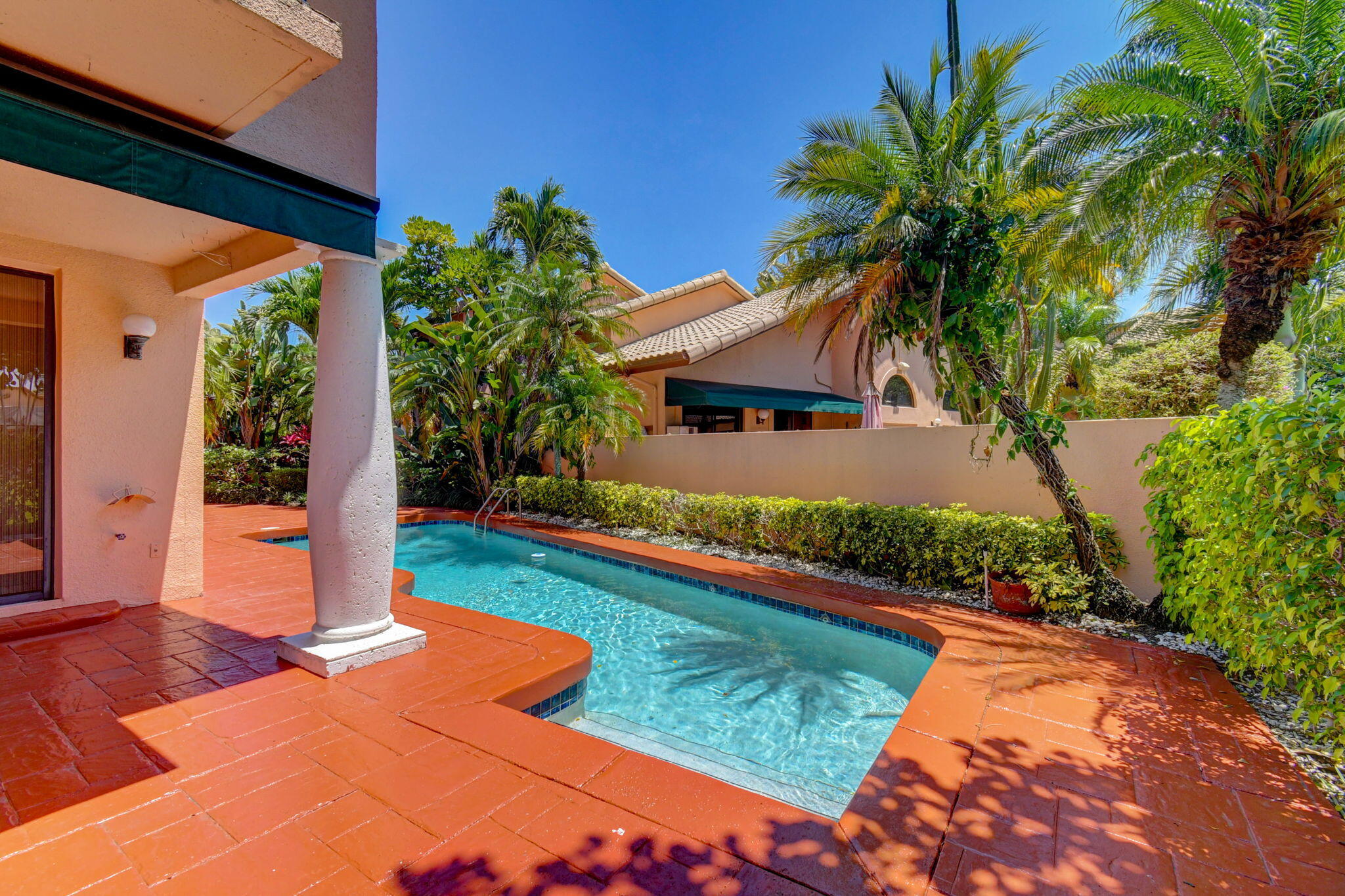 6427 Via Rosa Boca Raton, FL 33433 - Photo 70 of 80 a front view of house with yard and swimming pool