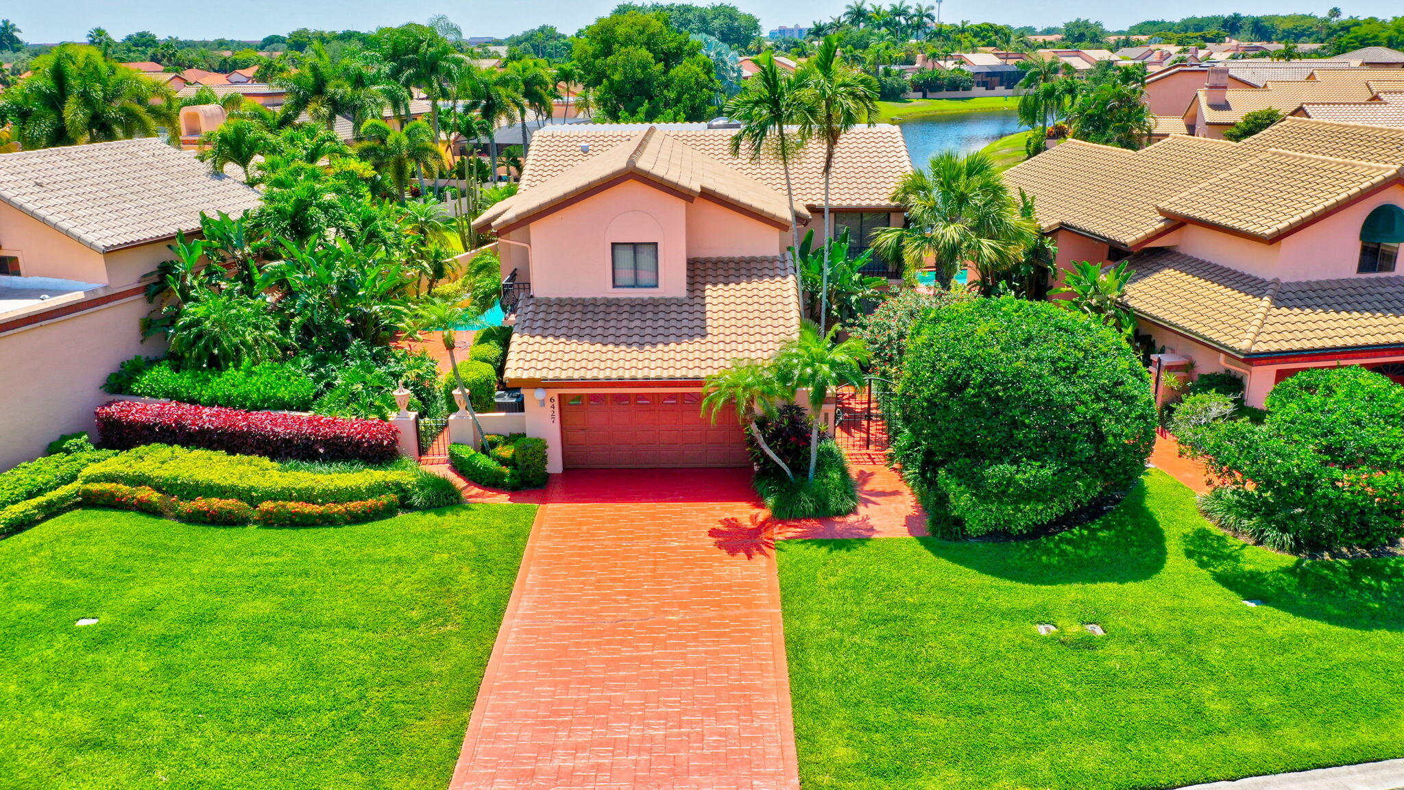6427 Via Rosa Boca Raton, FL 33433 - Photo 74 of 80 a view of backyard with table and chairs and potted plants
