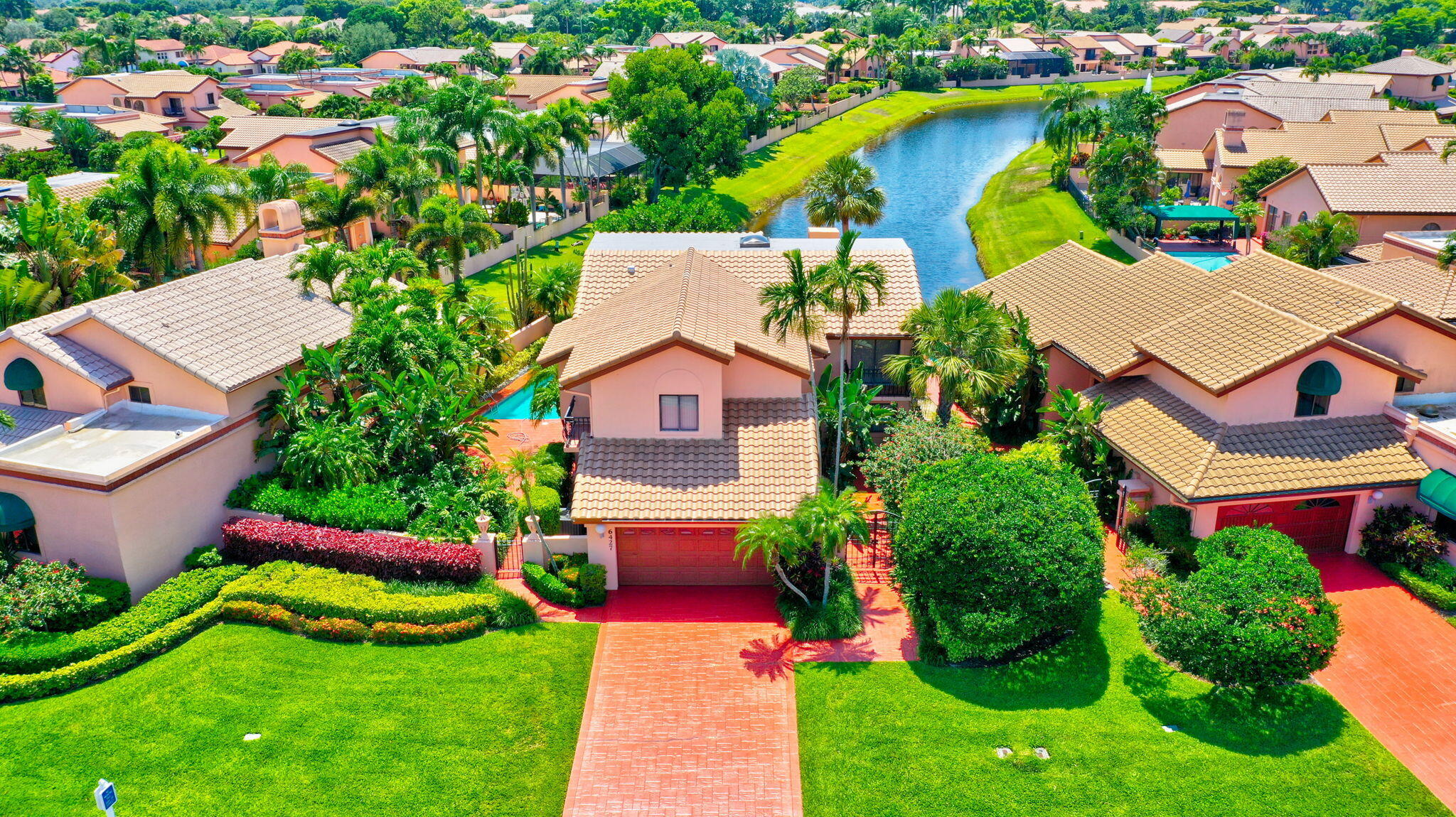 6427 Via Rosa Boca Raton, FL 33433 - Photo 75 of 80 an aerial view of a house with a garden and swimming pool