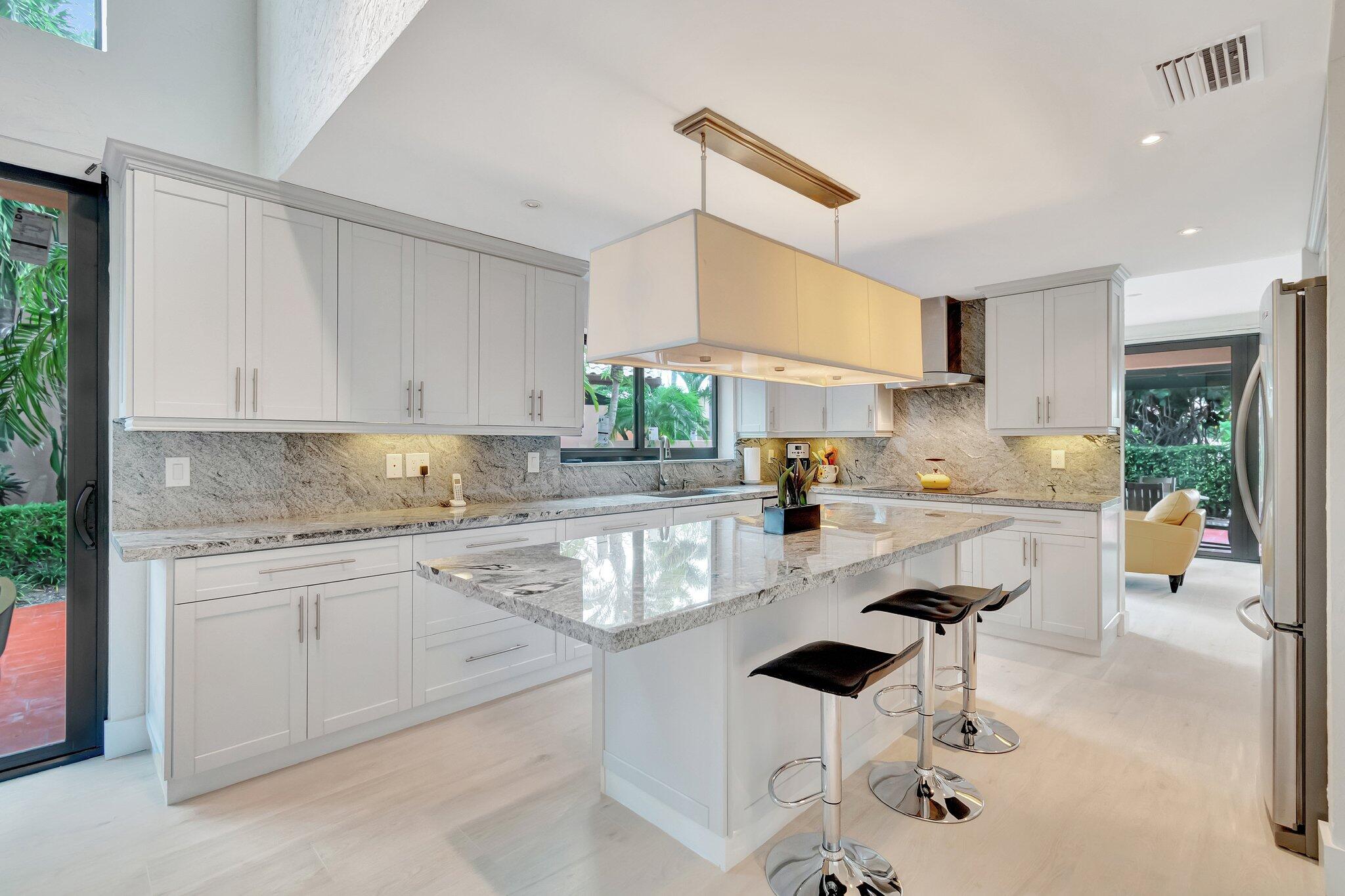 6427 Via Rosa Boca Raton, FL 33433 - Photo 10 of 80 a kitchen with a sink cabinets and window