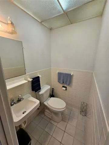 a bathroom with a toilet and a sink