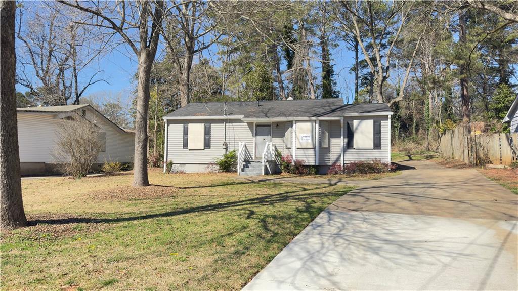 4262 Lindsey Drive Decatur, GA 30035 - Photo 2 of 7 a view of a house with snow on the road