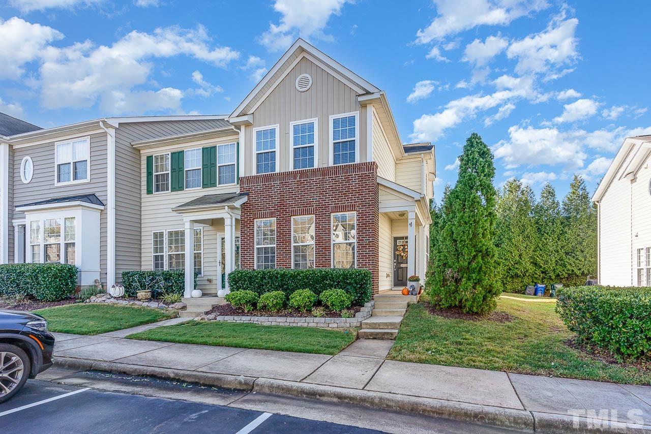 7859 Silverthread Lane Raleigh, NC 27617 - Photo 2 of 25 a front view of a house with a yard