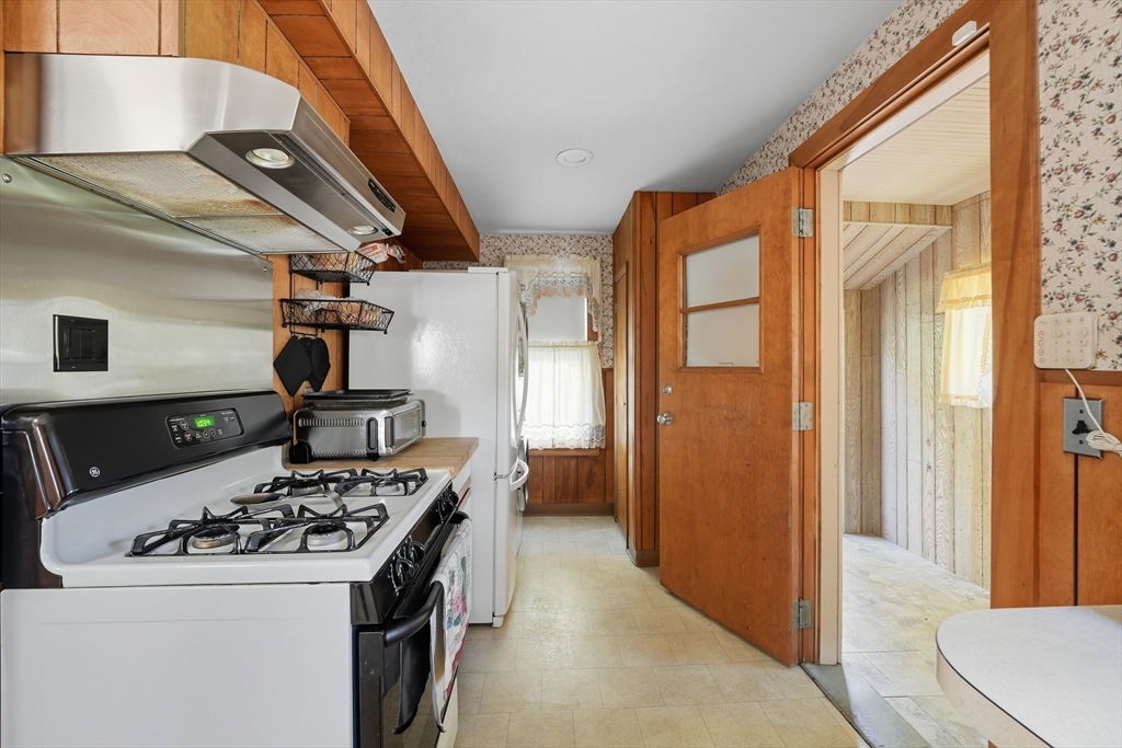 30 Athol Street Springfield, MA 01107 - Photo 12 of 38 a kitchen with a stove and a refrigerator