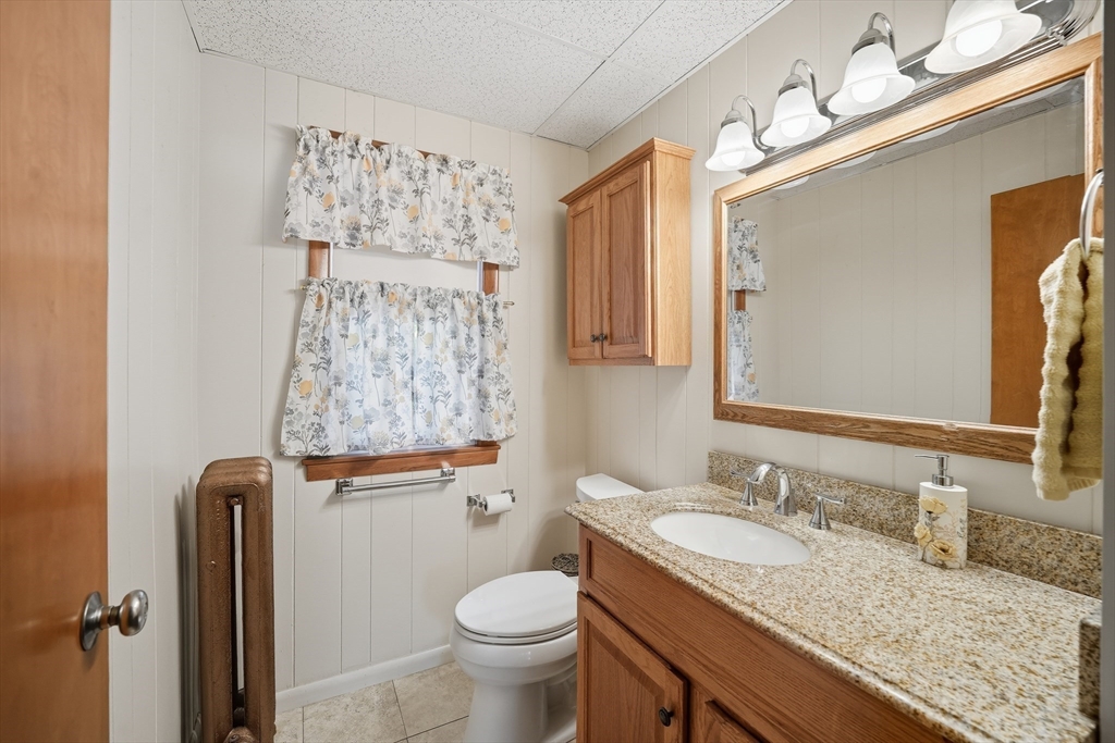 30 Athol Street Springfield, MA 01107 - Photo 13 of 38 a bathroom with a granite countertop sink toilet and shower