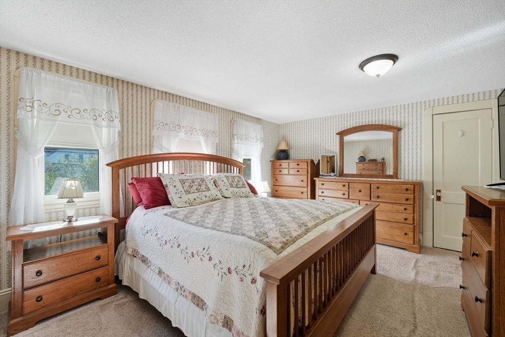30 Athol Street Springfield, MA 01107 - Photo 14 of 38 a bedroom with a bed and a dresser