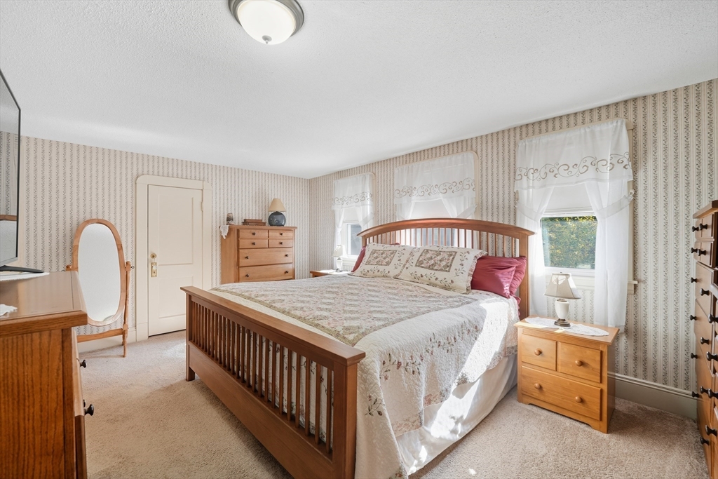 30 Athol Street Springfield, MA 01107 - Photo 15 of 38 a bedroom with a bed and a dresser