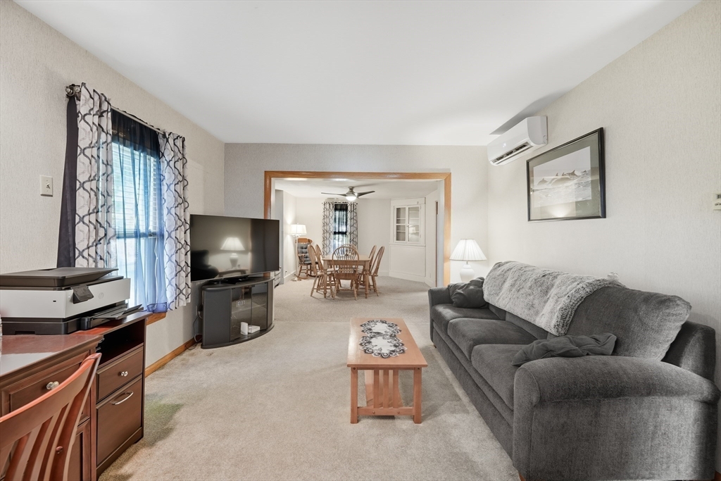 30 Athol Street Springfield, MA 01107 - Photo 2 of 38 a living room with furniture a flat screen tv and a window