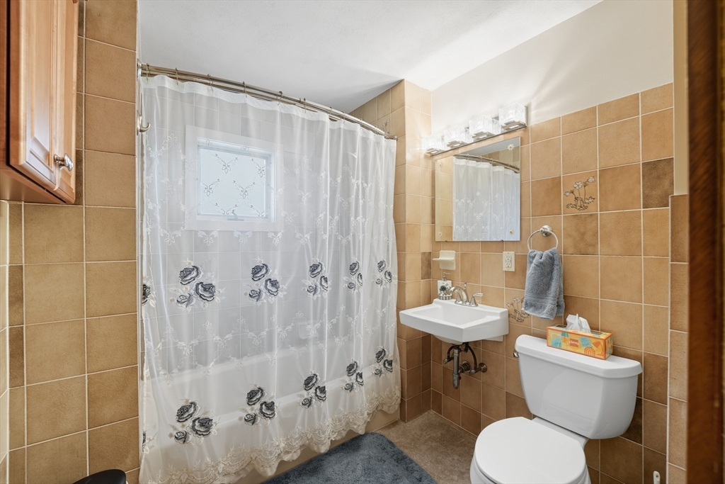 30 Athol Street Springfield, MA 01107 - Photo 22 of 38 a bathroom with a toilet sink and shower