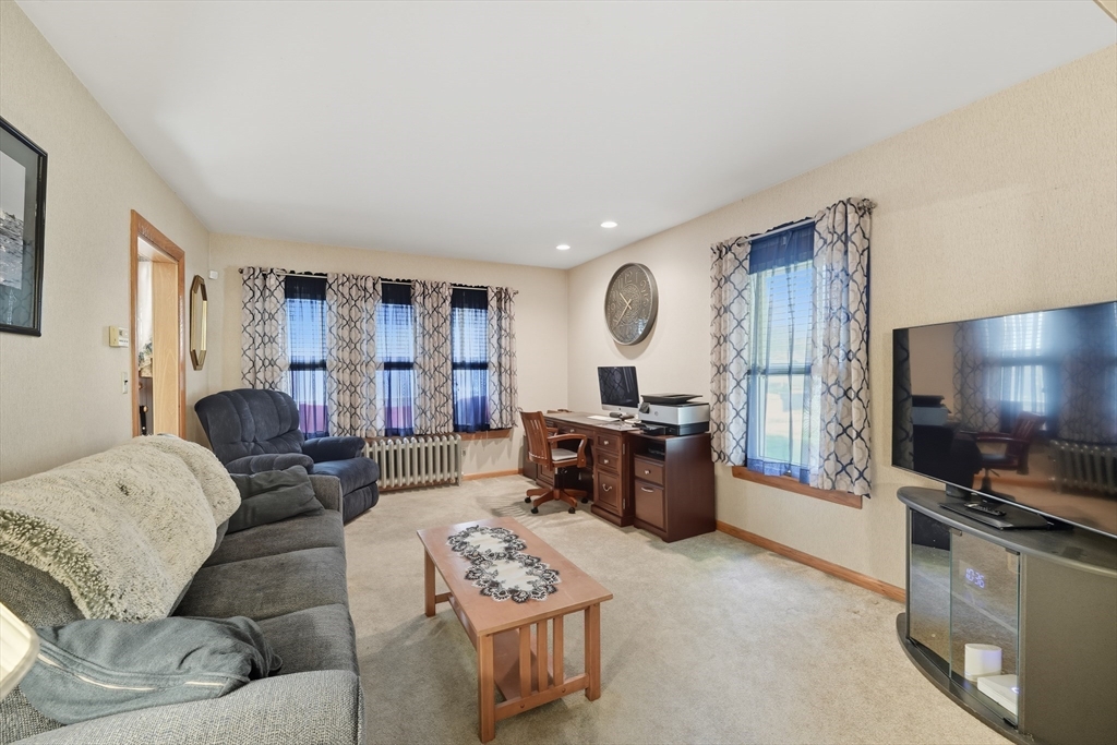 30 Athol Street Springfield, MA 01107 - Photo 3 of 38 a living room with furniture and a flat screen tv