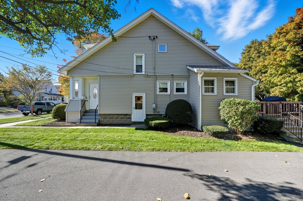 30 Athol Street Springfield, MA 01107 - Photo 33 of 38 a front view of a house with a yard and garage