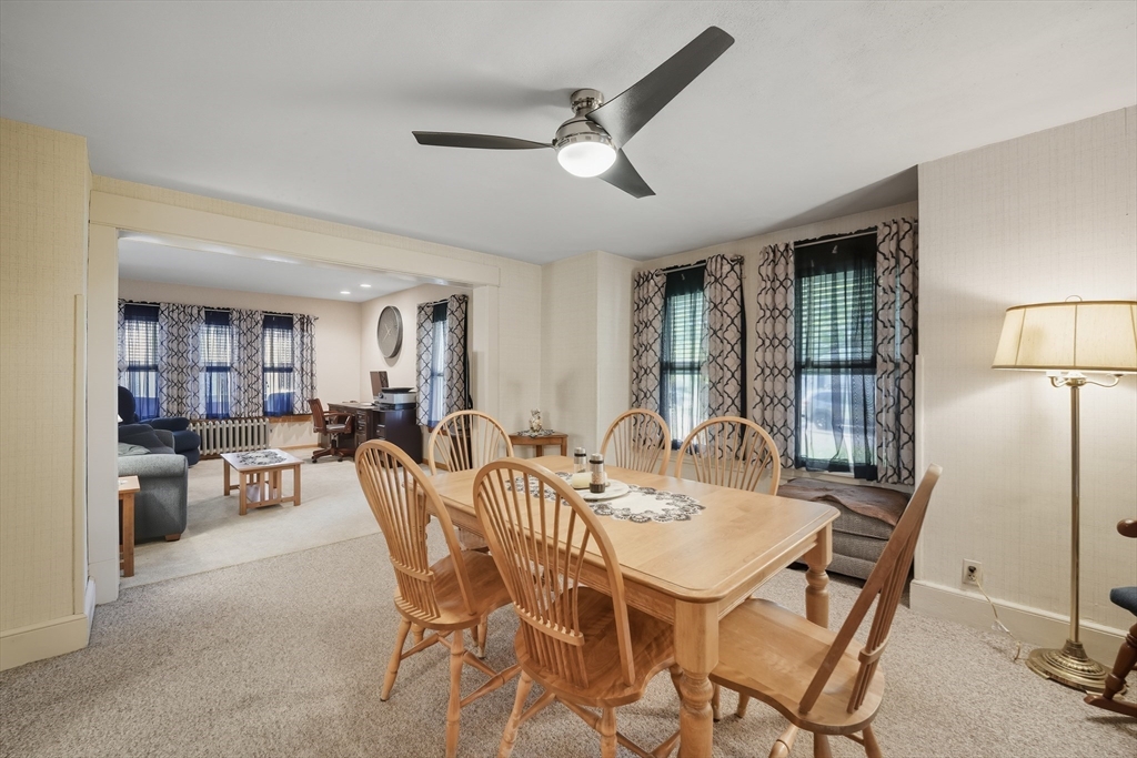 30 Athol Street Springfield, MA 01107 - Photo 6 of 38 a view of a dining room with furniture and a chandelier