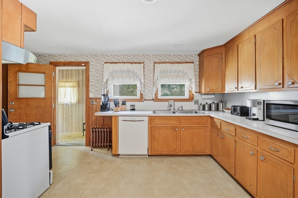 30 Athol Street Springfield, MA 01107 - Photo 9 of 38 a kitchen with granite countertop a refrigerator stove top oven and sink