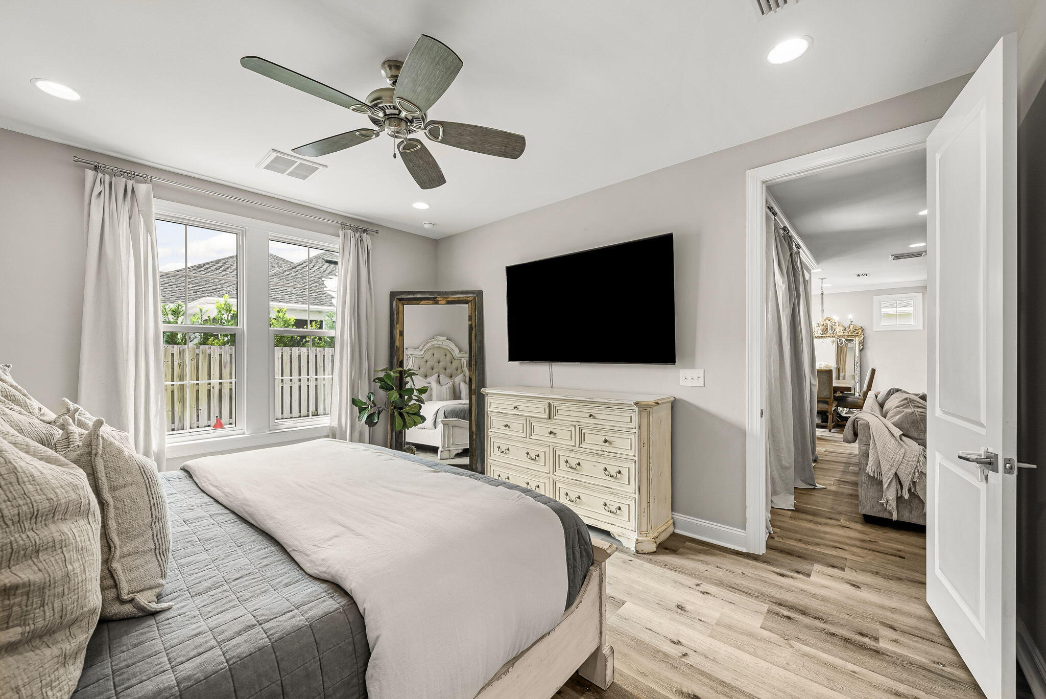 290 Windrow Way Watersound, FL 32461 - Photo 26 of 43 a bedroom with a bed tv and a window