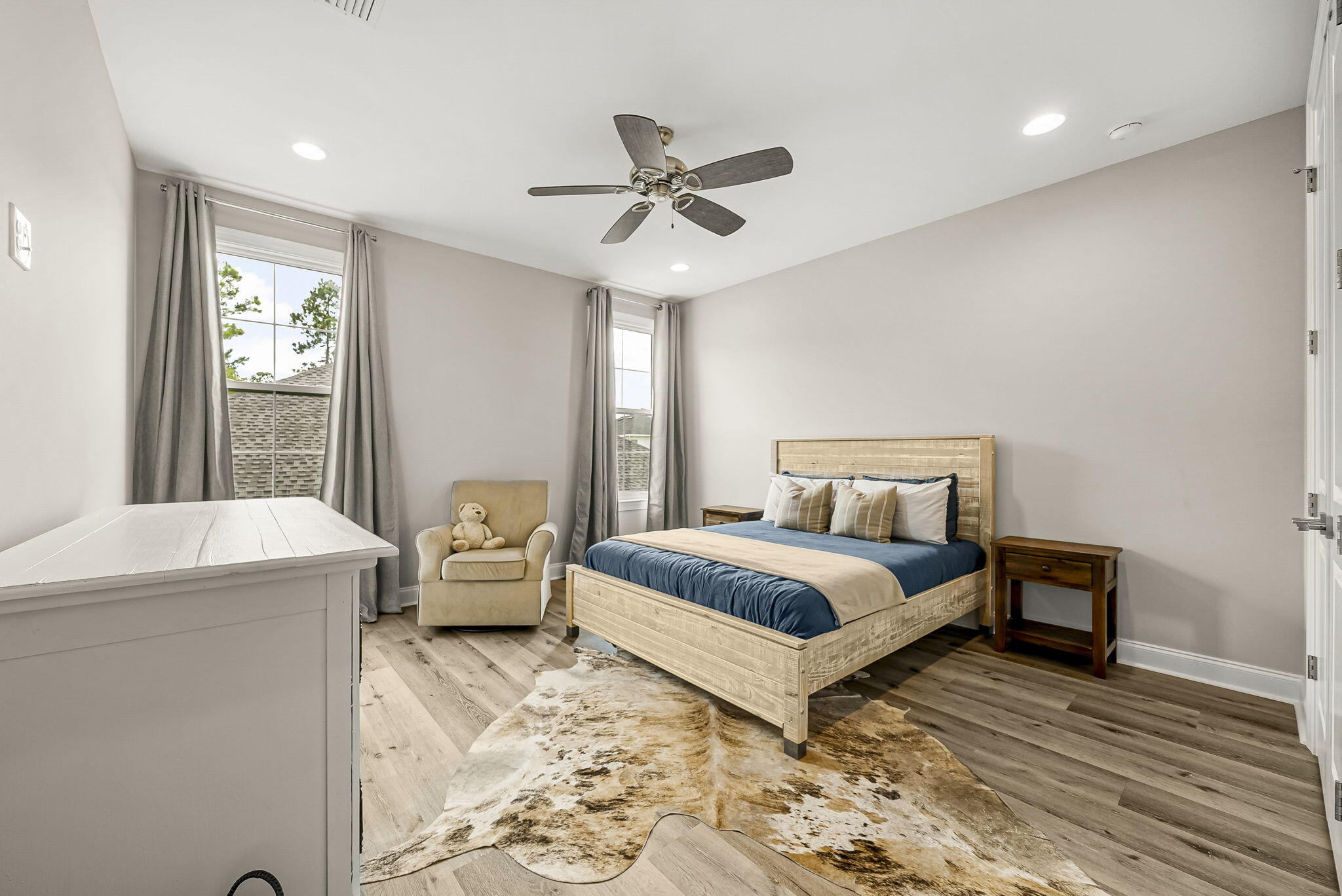290 Windrow Way Watersound, FL 32461 - Photo 31 of 43 a bedroom with a bed and a chandelier