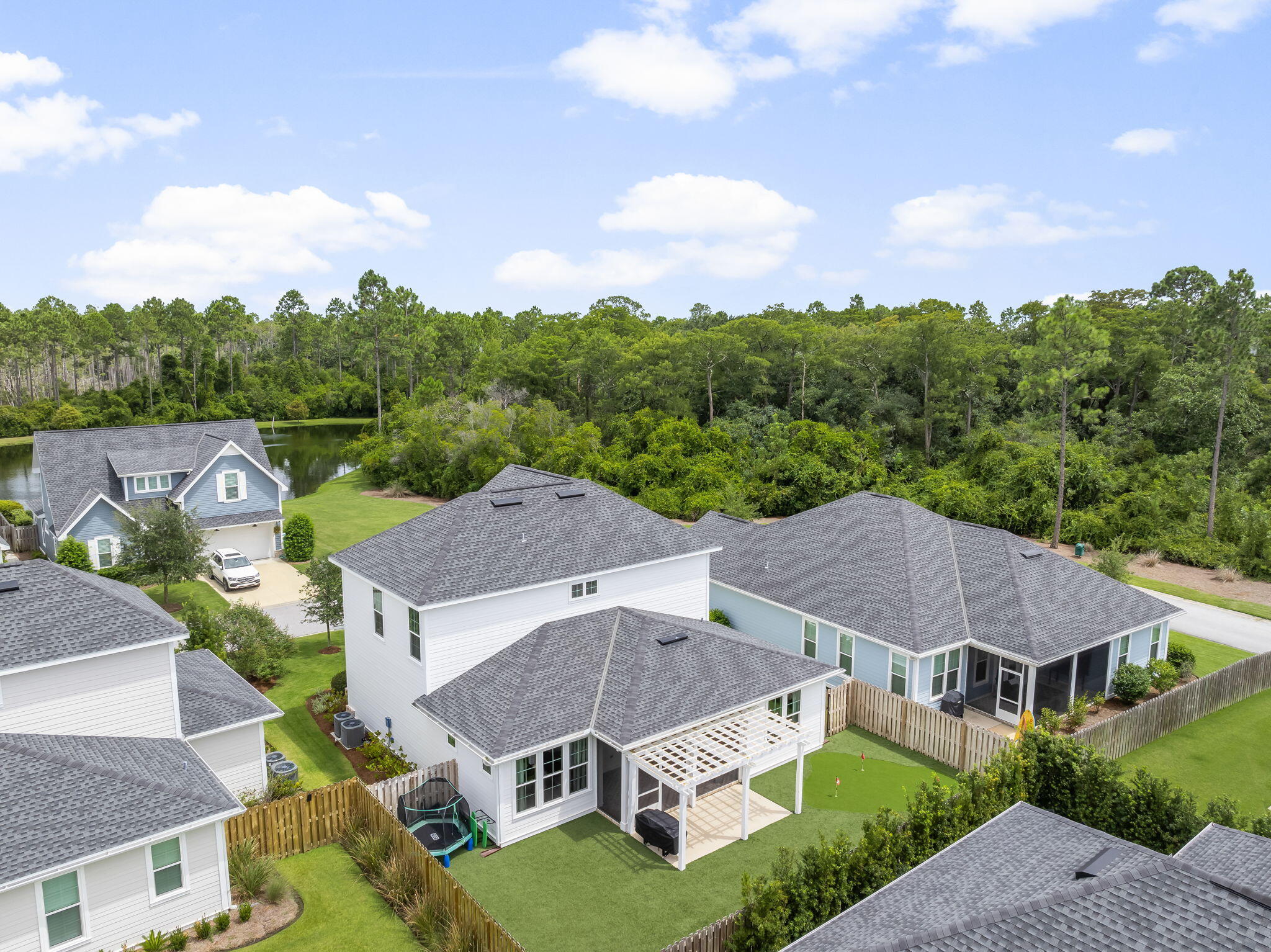 290 Windrow Way Watersound, FL 32461 - Photo 41 of 43 a view of a big house with a big yard plants and large trees