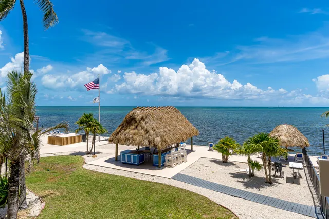 a bed room with a bed and a chandelier