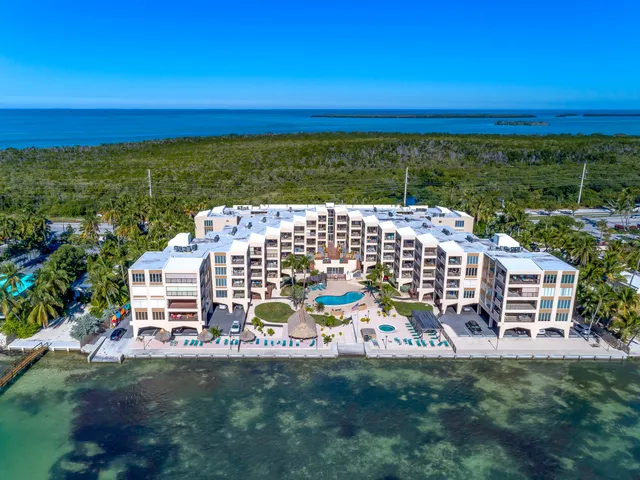a view of a workspace with furniture and wooden floor