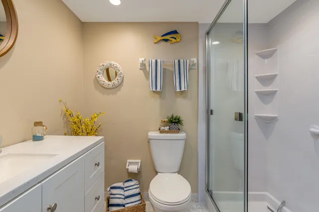 a kitchen with stainless steel appliances a sink a stove a microwave and cabinets