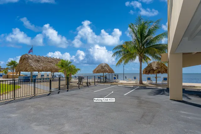 an aerial view of a swimming pool patio and outdoor seating