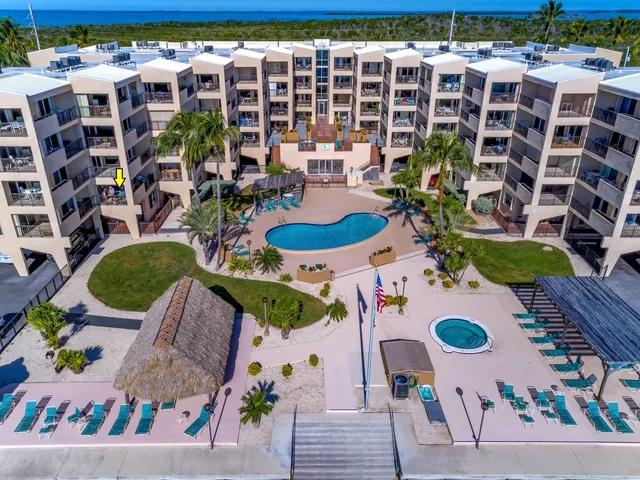 a view of a swimming pool with a lounge chair