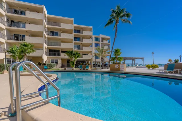 a view of a patio with a table and chairs