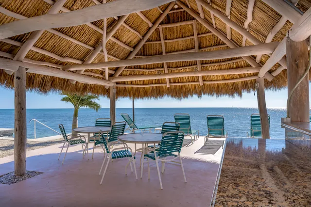 a terrace with a table and chairs