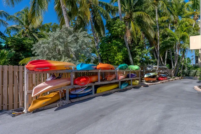 a bathroom with a sink toilet a mirror and shower
