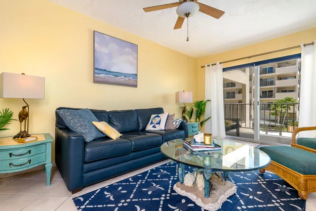 a living room with furniture and a table