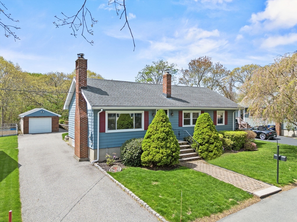 7 Cedarcrest Road Salem, MA 01970 - Photo 1 of 41 a front view of a house with a yard and garage