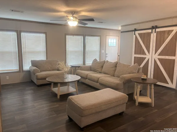 a living room with furniture and a window