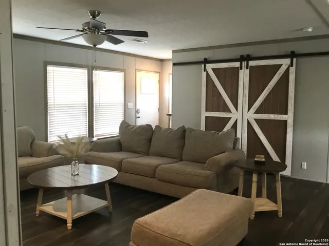 a living room with furniture and a window