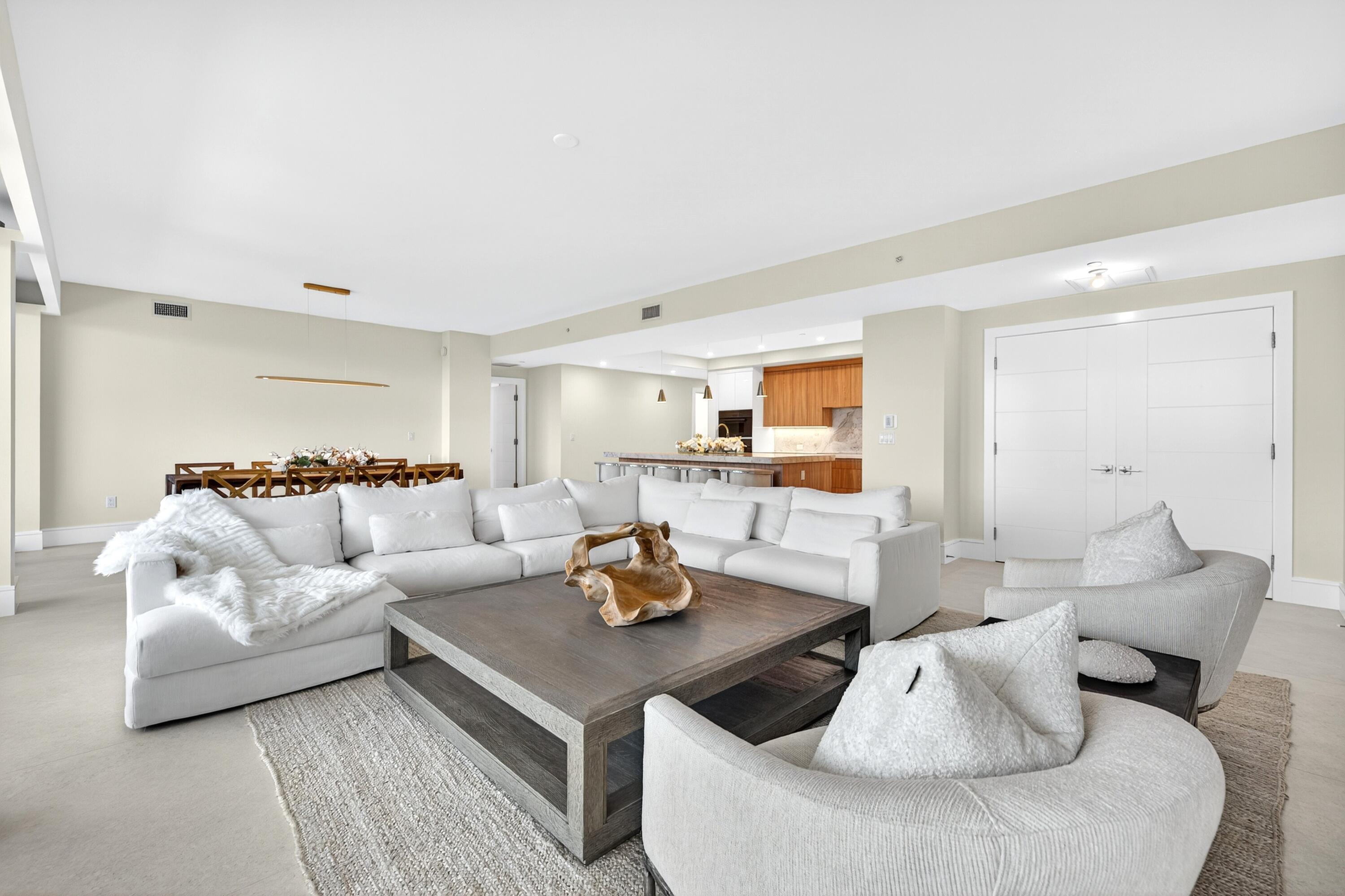 1 South Coastal Way, Unit 3030 Jupiter, FL 33477 - Photo 11 of 61 a living room with furniture and view of kitchen