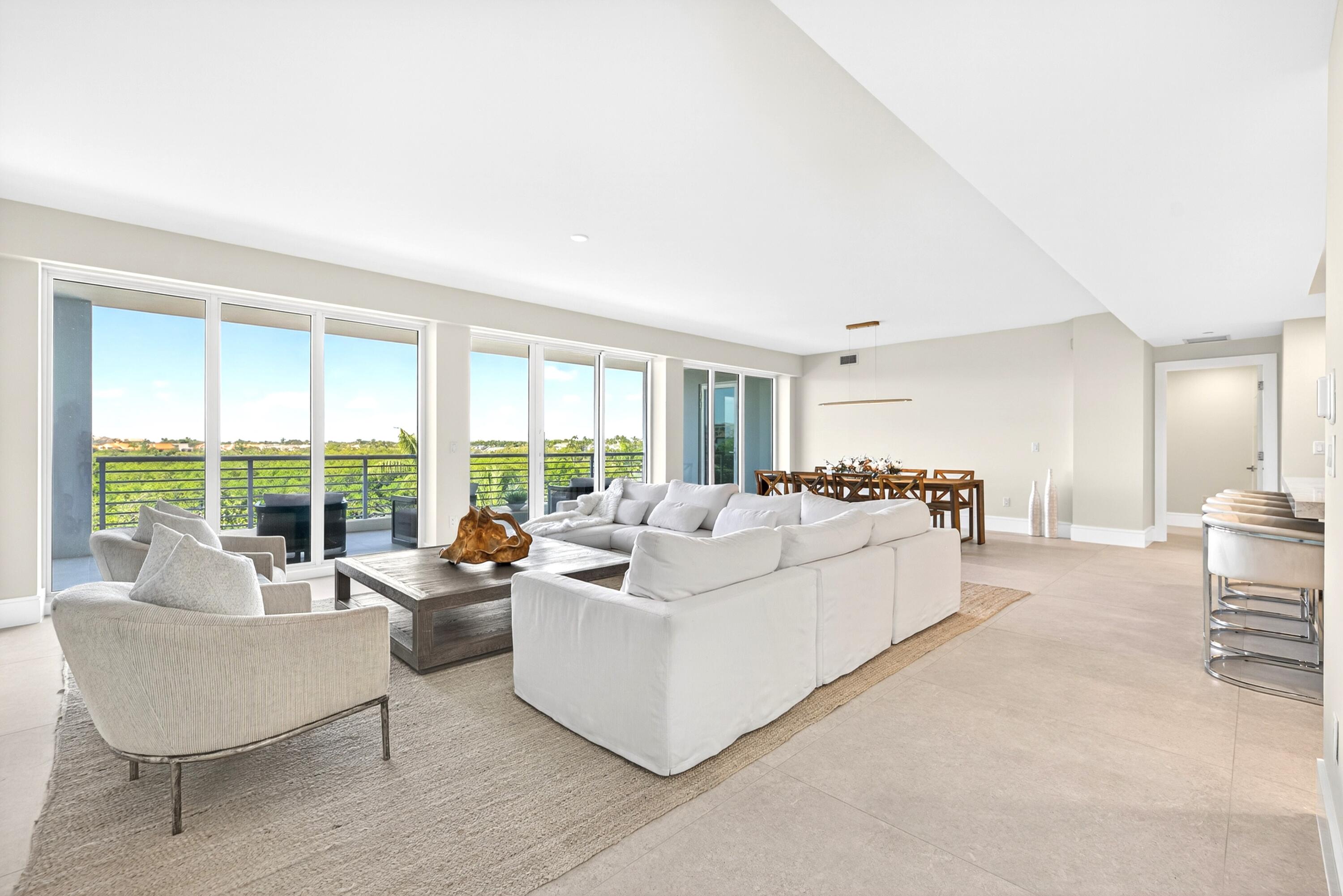 1 South Coastal Way, Unit 3030 Jupiter, FL 33477 - Photo 12 of 61 a living room with furniture and a large window