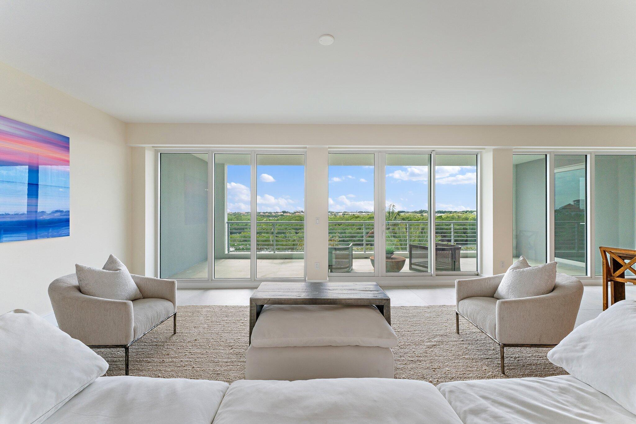 1 South Coastal Way, Unit 3030 Jupiter, FL 33477 - Photo 13 of 61 a living room with furniture and a large window