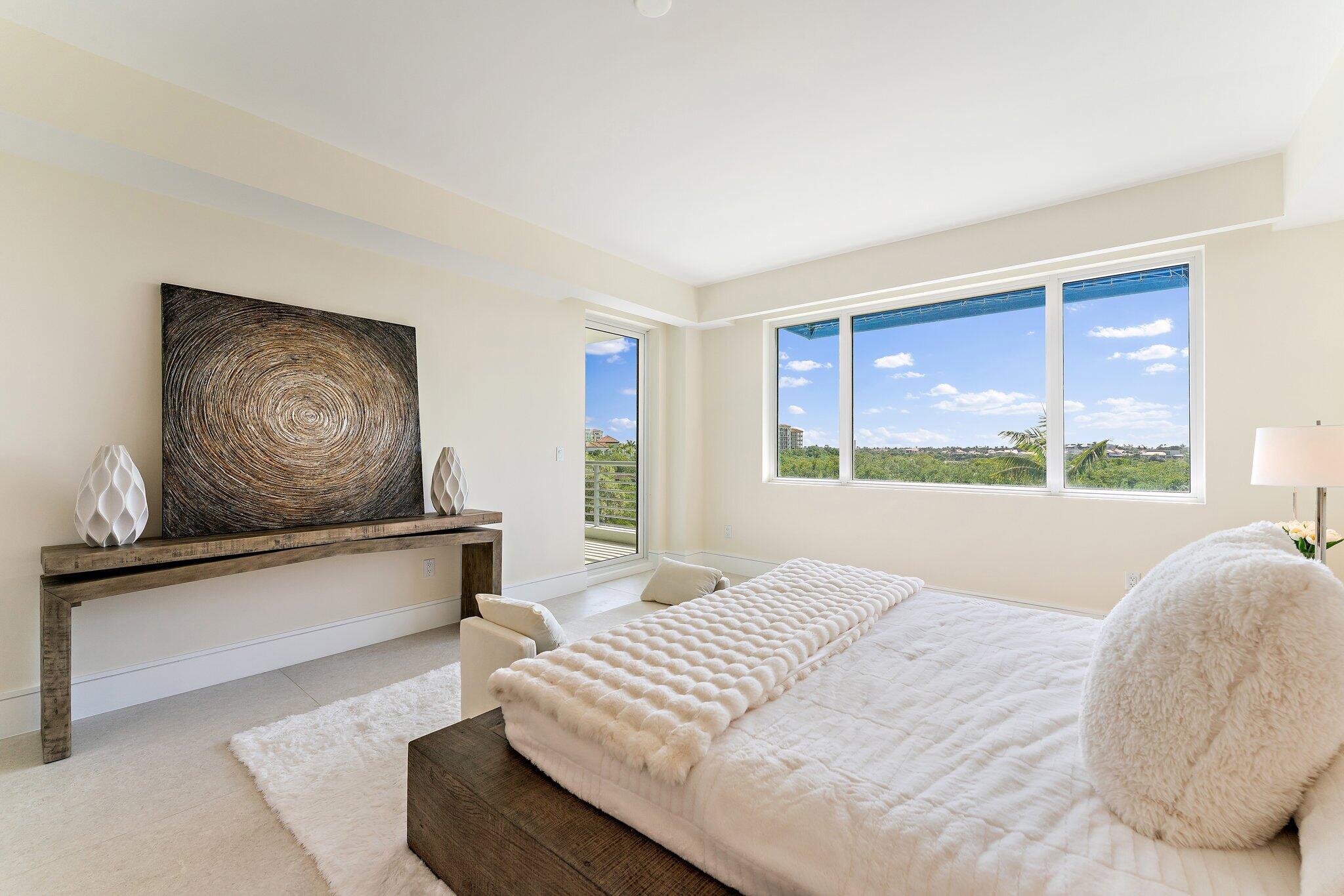 1 South Coastal Way, Unit 3030 Jupiter, FL 33477 - Photo 16 of 61 a bedroom with a large bed and a window