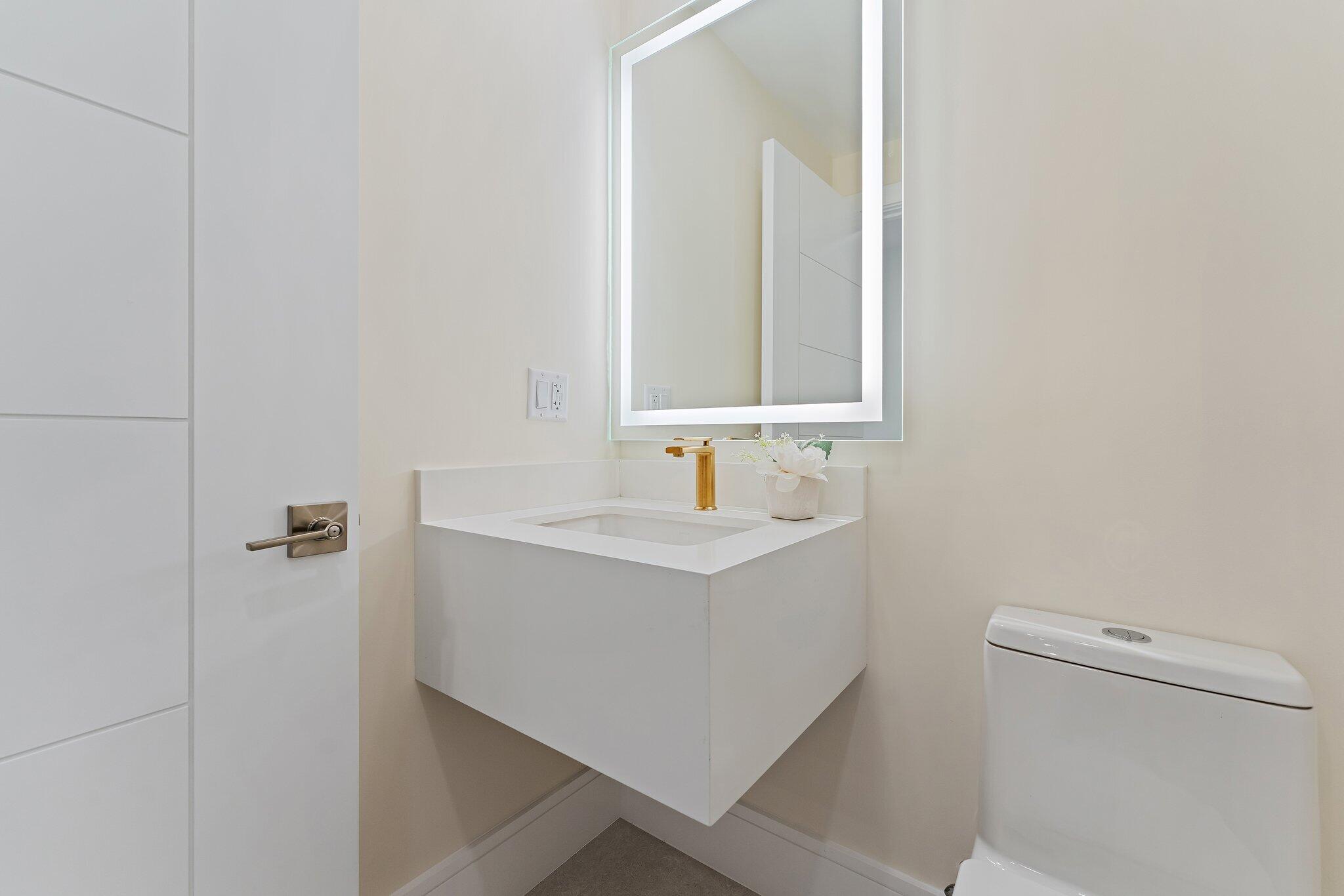 1 South Coastal Way, Unit 3030 Jupiter, FL 33477 - Photo 21 of 61 a bathroom with a sink a toilet and shower