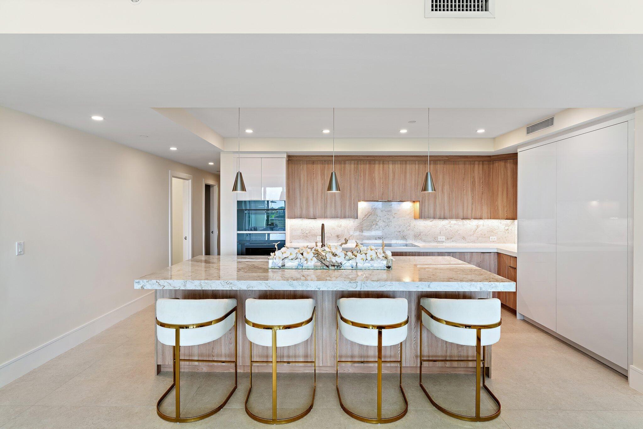 1 South Coastal Way, Unit 3030 Jupiter, FL 33477 - Photo 4 of 61 a kitchen with a table and chairs in it