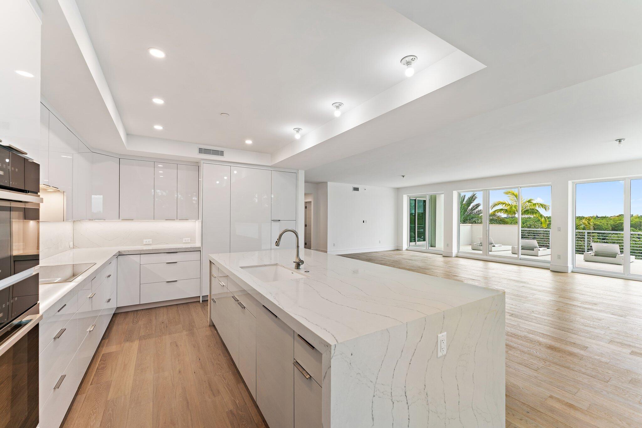 1 South Coastal Way, Unit 3030 Jupiter, FL 33477 - Photo 47 of 61 a large white kitchen with a large window
