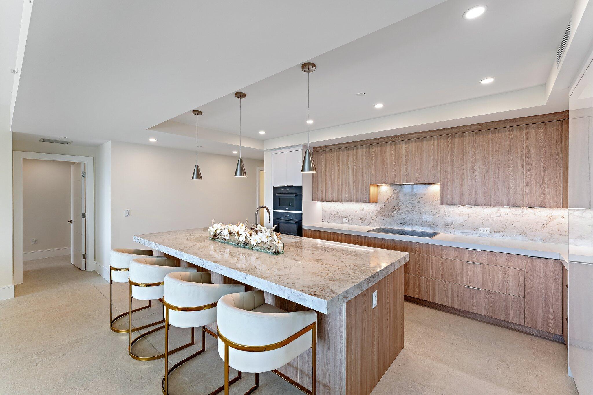 1 South Coastal Way, Unit 3030 Jupiter, FL 33477 - Photo 5 of 61 a kitchen with a table and chairs in it
