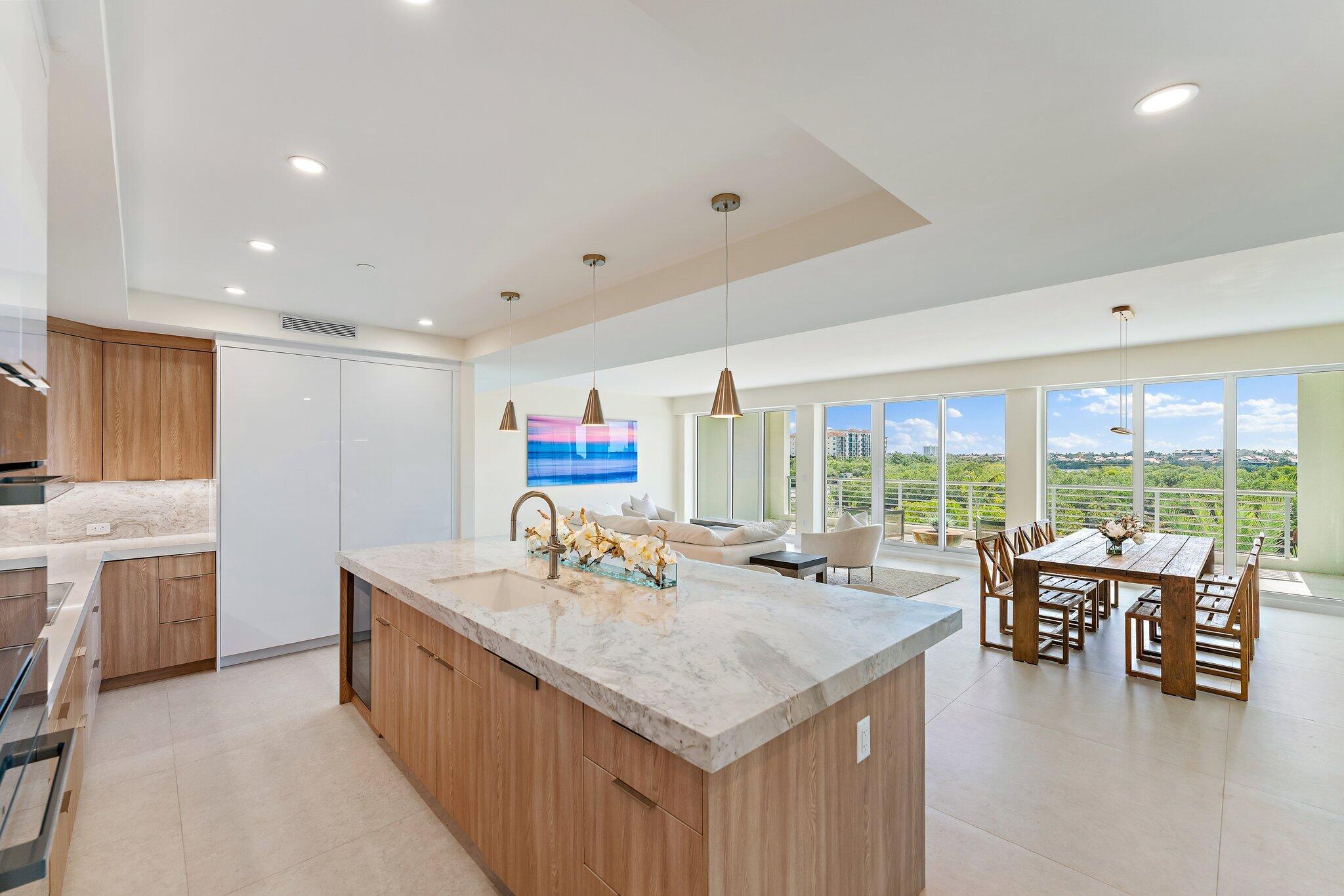 1 South Coastal Way, Unit 3030 Jupiter, FL 33477 - Photo 8 of 61 a kitchen with sink and view of living room