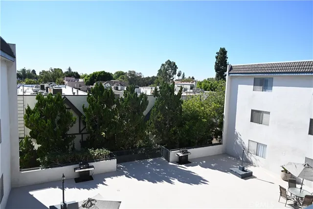 a view of parking garage with cars parked