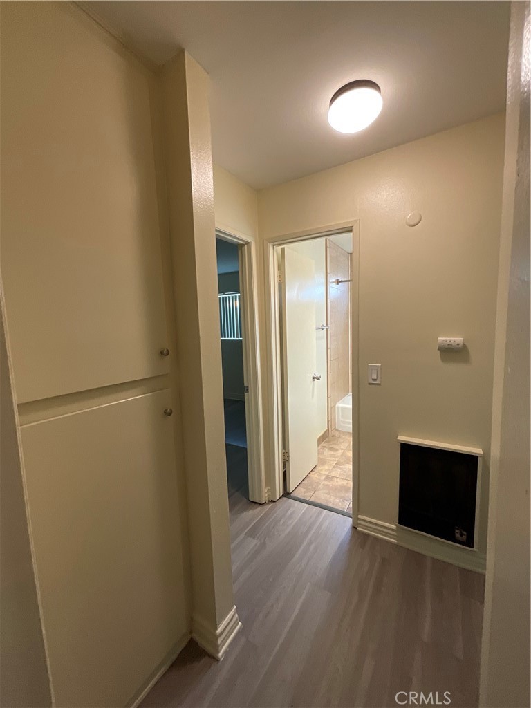 6042 Lime Avenue, Unit B Cypress, CA 90630 - Photo 12 of 20 a view of a hallway with wooden floor and staircase