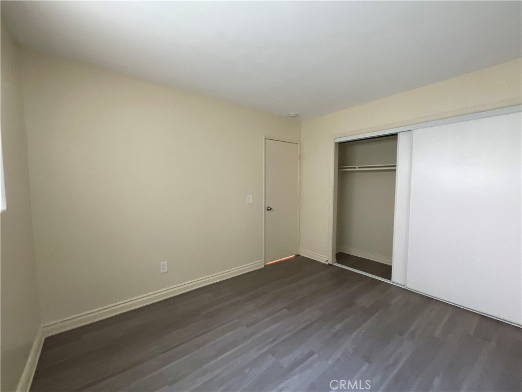6042 Lime Avenue, Unit B Cypress, CA 90630 - Photo 18 of 20 a view of an empty room with wooden floor