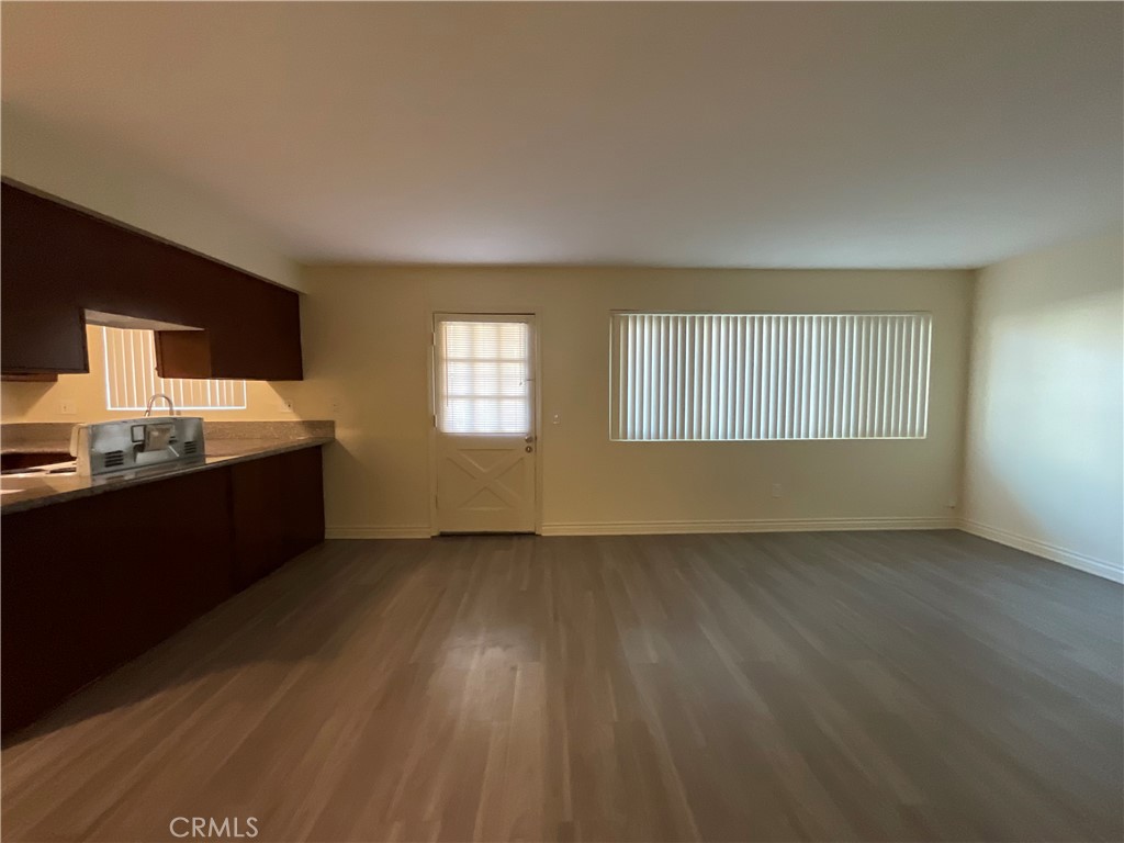 6042 Lime Avenue, Unit B Cypress, CA 90630 - Photo 4 of 20 a view of wooden floor and windows in a room