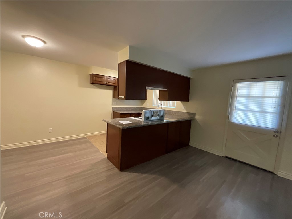 6042 Lime Avenue, Unit B Cypress, CA 90630 - Photo 5 of 20 a room with furniture wooden floor and a window