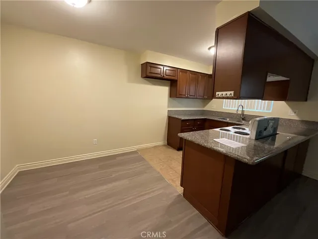a kitchen with a sink and a refrigerator