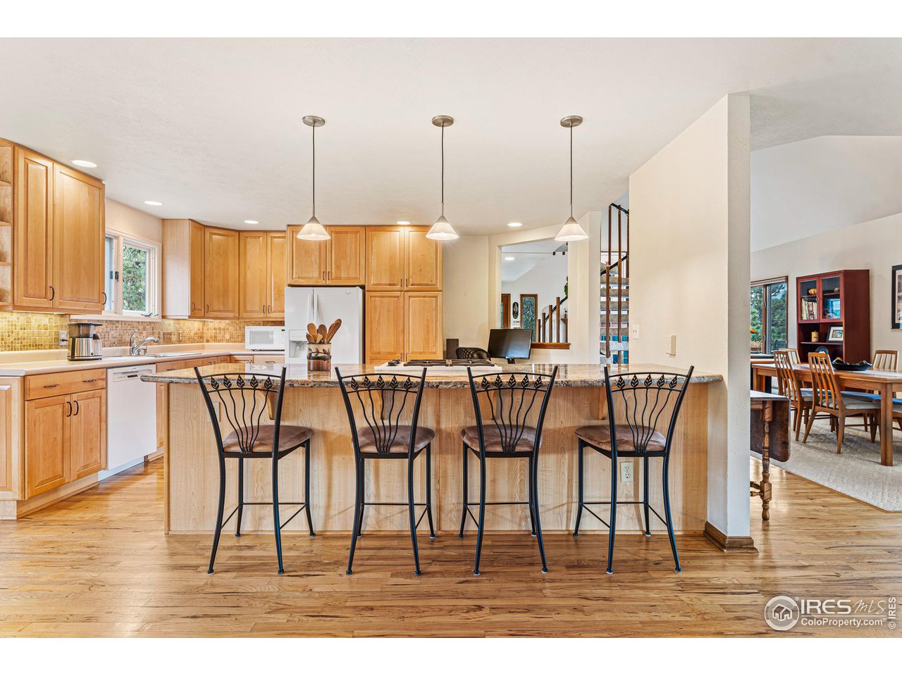 297 Broken Fence Road Boulder, CO 80302 - Photo 12 of 39 Eat-in kitchen island with thick slab granite countertop